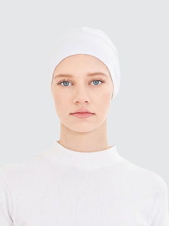 Imaarah white hijab undercap worn as lightweight base layer for modest styling
