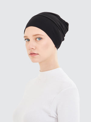 Imaarah breathable black hijab undercap showing smooth stretch fit and coverage