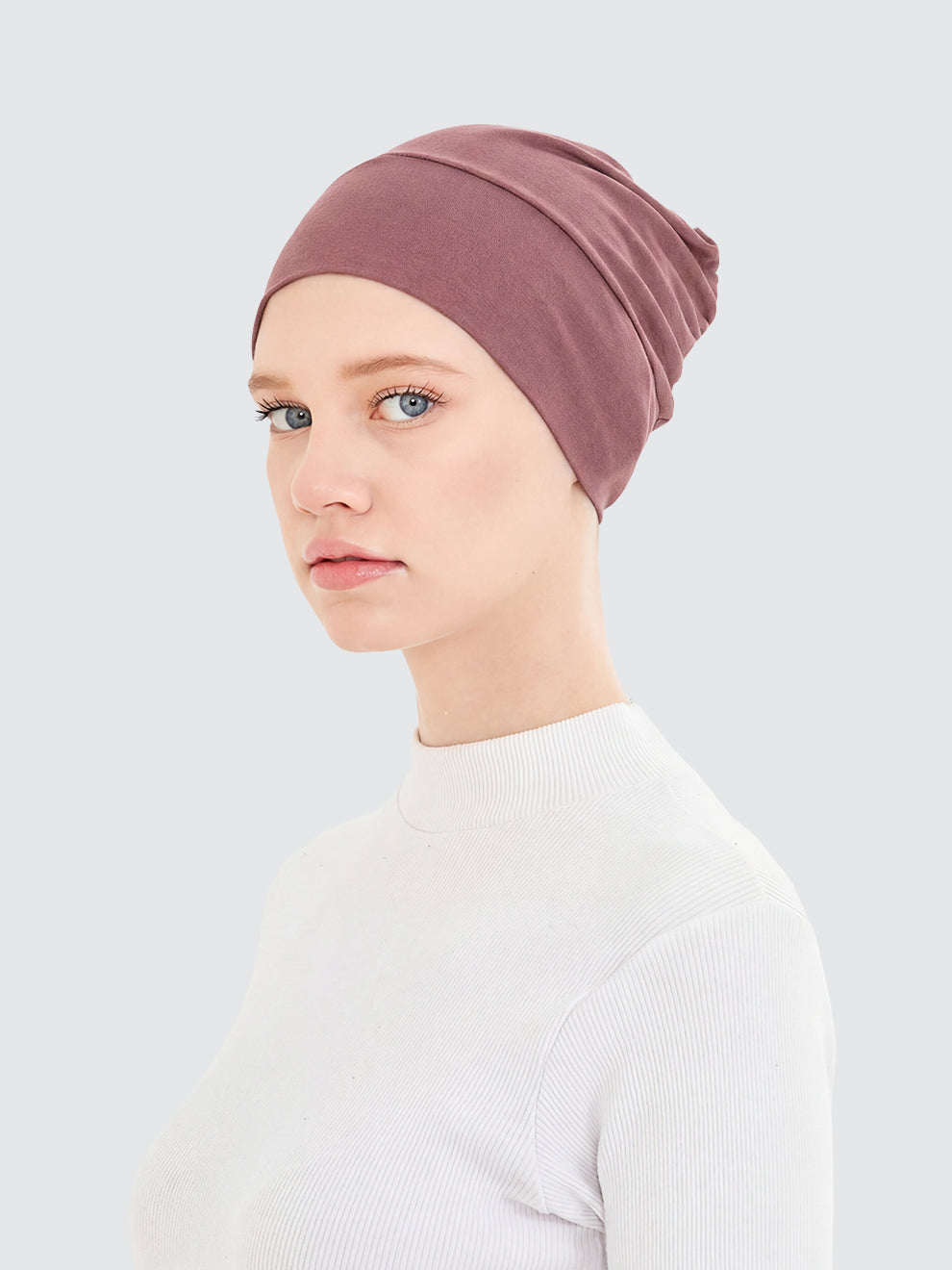 Imaarah dusty rose hijab undercap showing smooth stretch fit and coverage