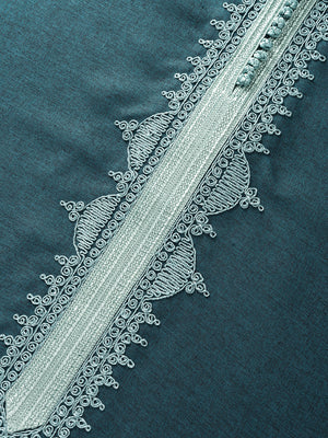 Seafoam green Moroccan-inspired embroidery detail on emerald green thobe fabric