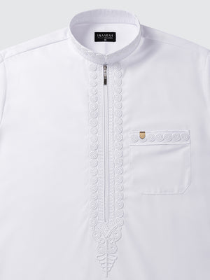 Premium white Moroccan thobe with imperial embroidery detailing along the neckline and placket, elegant modest wear for weddings and Eid
