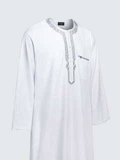 Side view of Imaarah Andalus long sleeve Moroccan thobe in white highlighting relaxed fit and grey embroidery detailing