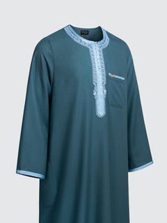 Side view of emarald green Moroccan long sleeve thobe with sky blue embroidery and long sleeves