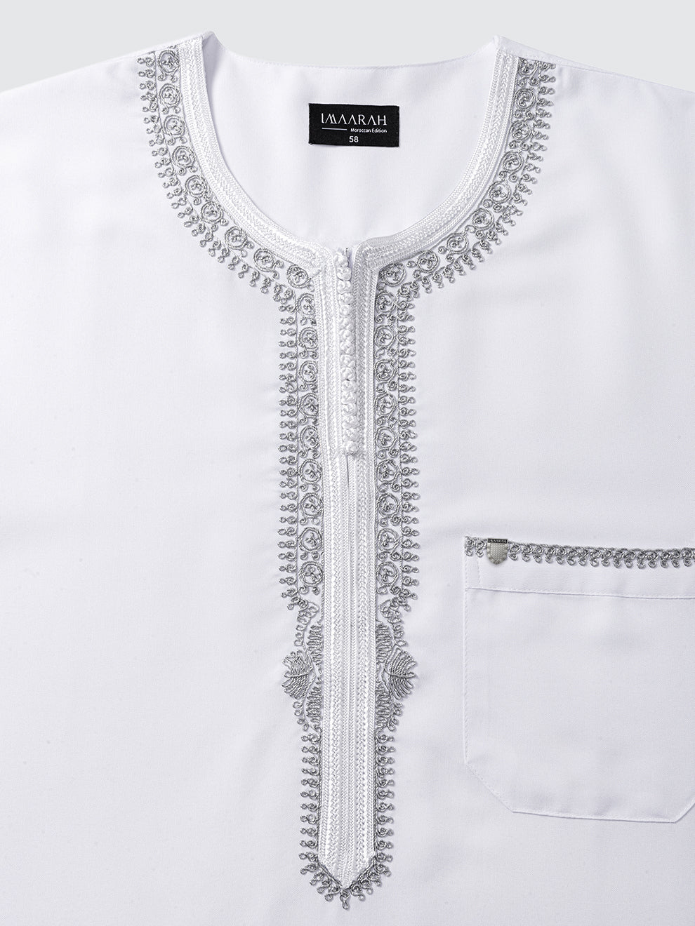 Close view of the Imaarah Andalus Moroccan thobe in white with grey embroidery