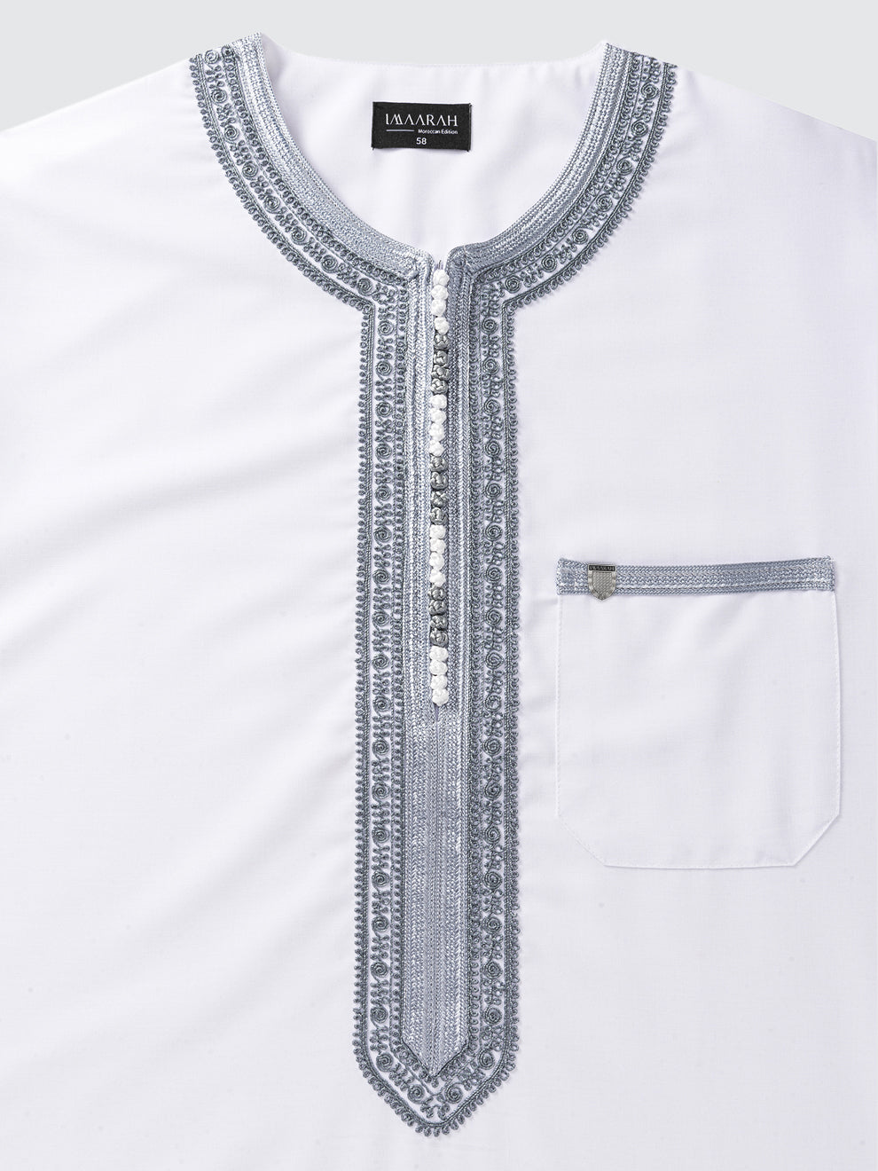 Close view of the Imaarah Sabil Moroccan short sleeve thobe in white with grey embroidery