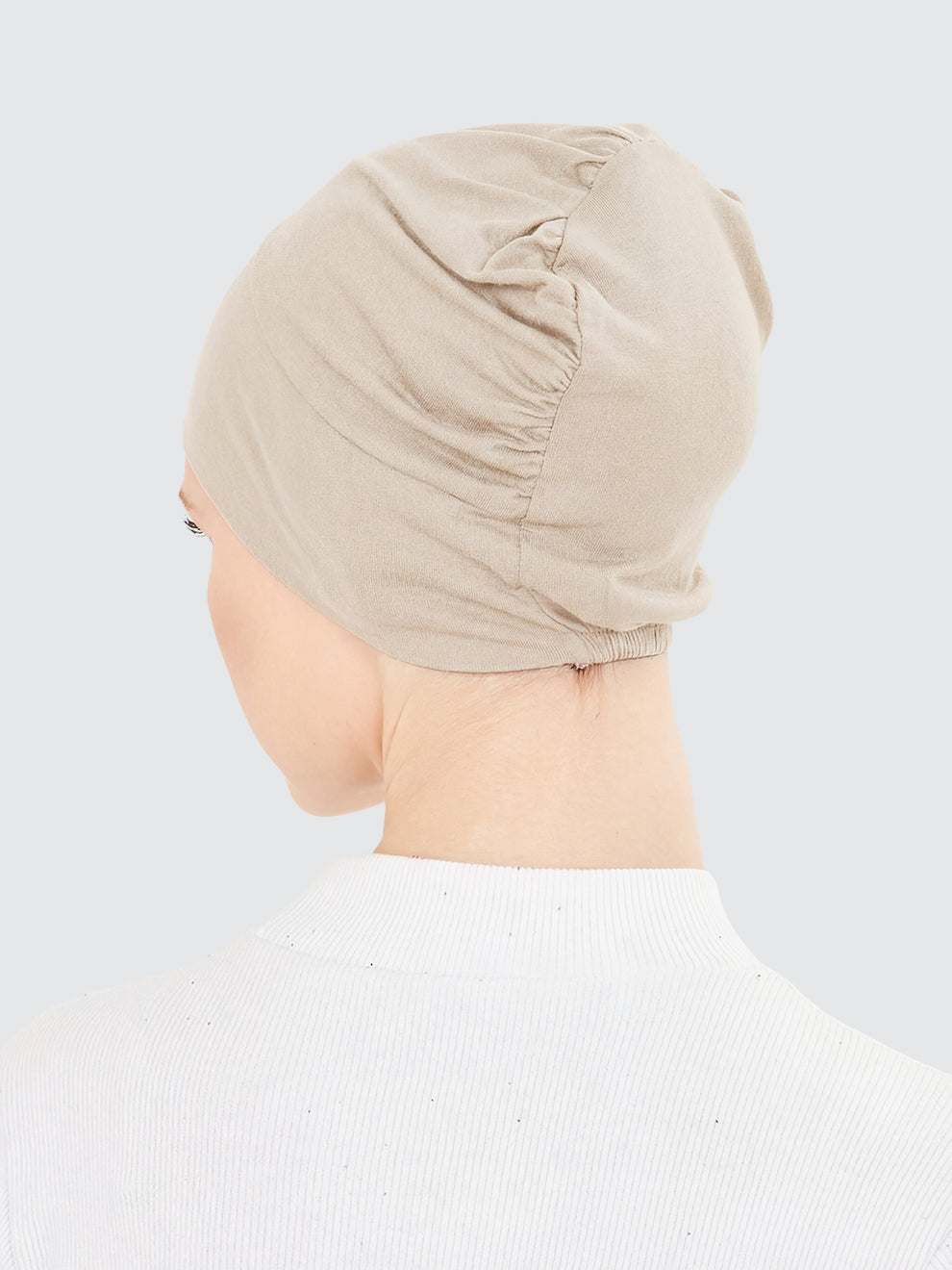 Imaarah sand beige hijab undercap back view showing gathered stretch construction
