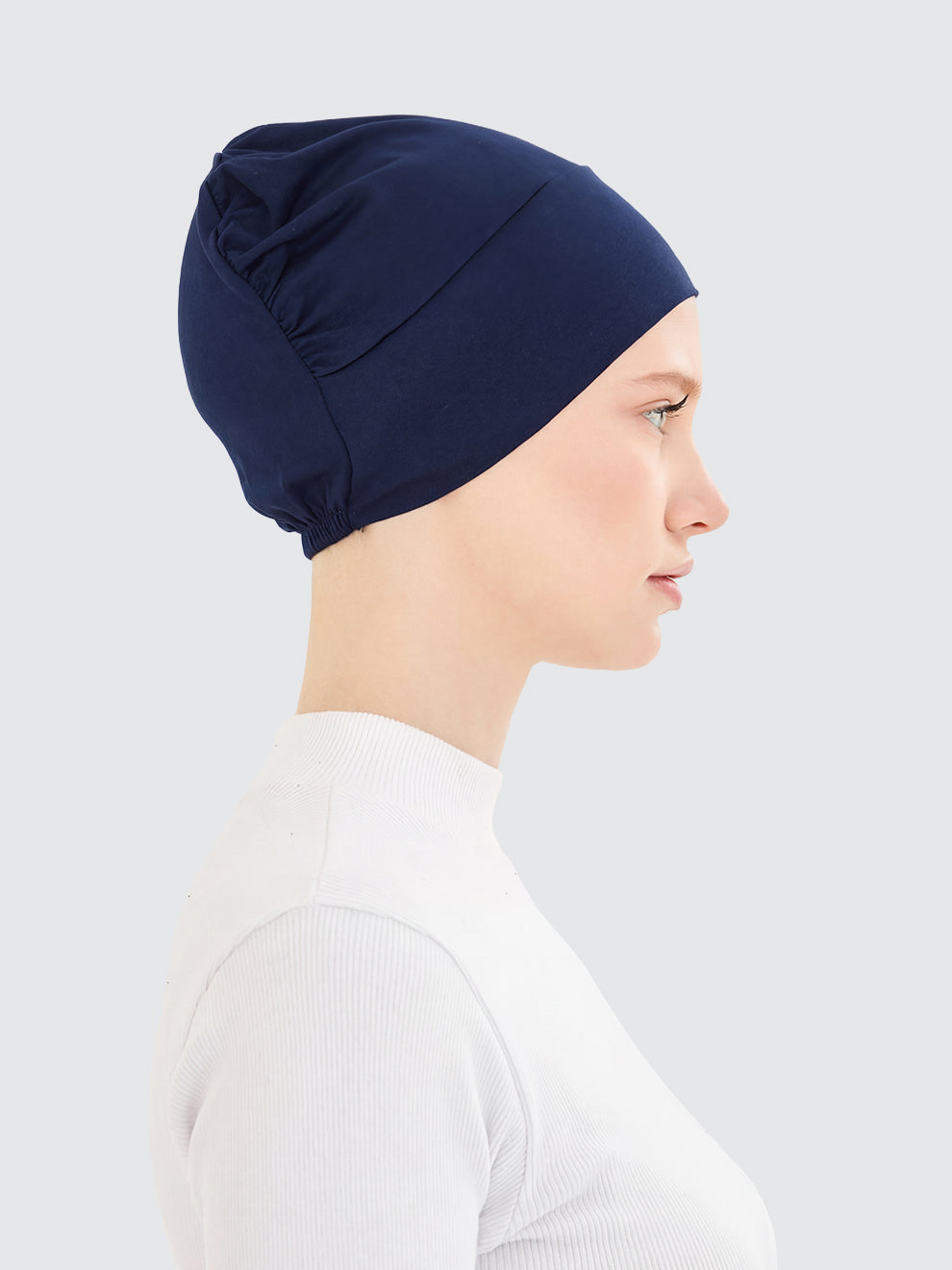 Imaarah navy hijab undercap side view made from viscose lycra blend