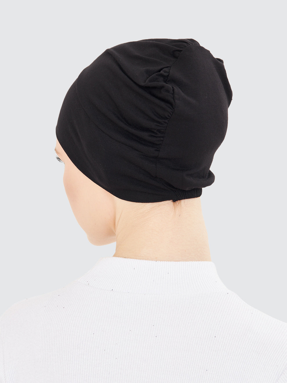 Imaarah black hijab undercap back view with gathered stretch for secure hold