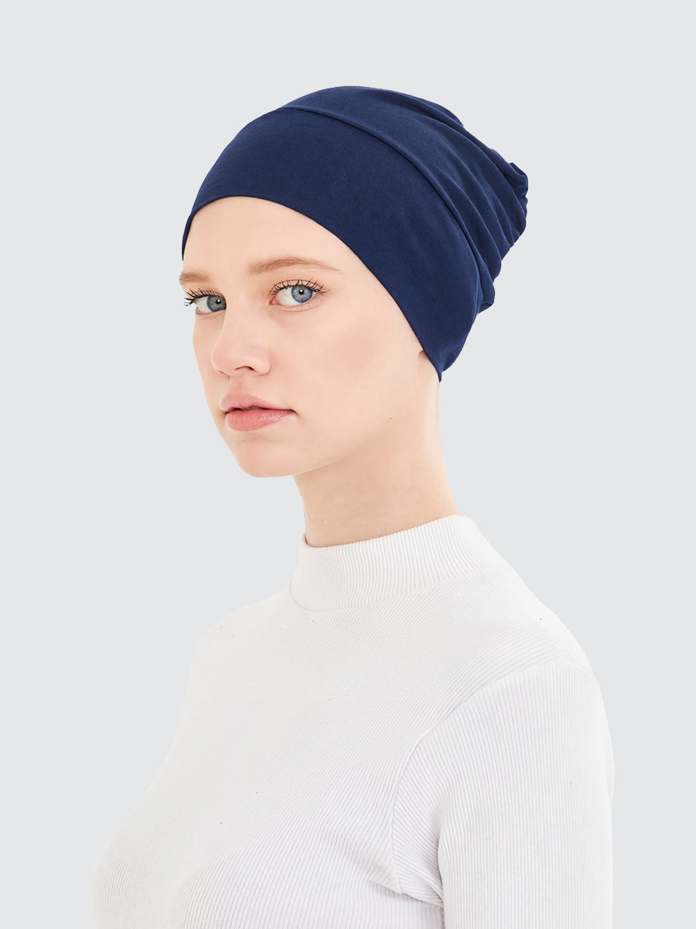 Imaarah navy blue hijab undercap showing smooth stretch coverage