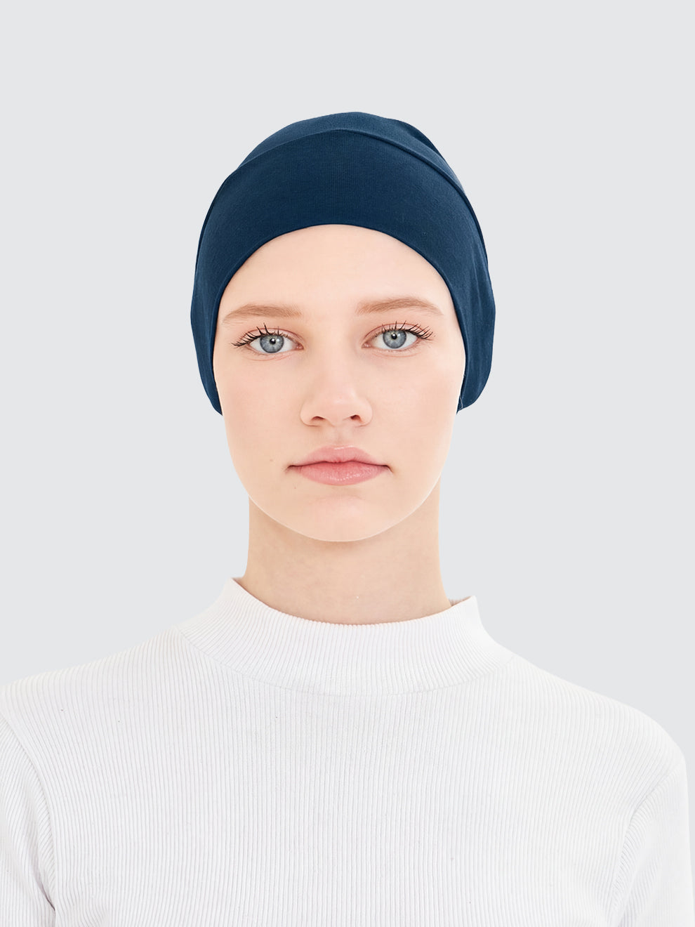 Imaarah teal hijab undercap worn as breathable inner layer for modest styling