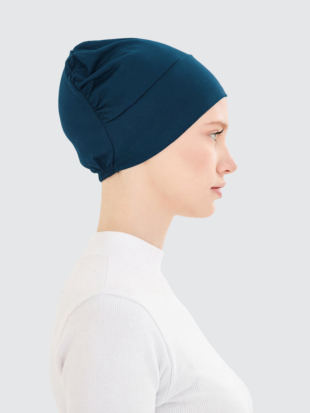 Imaarah teal hijab undercap side view with flexible lightweight design