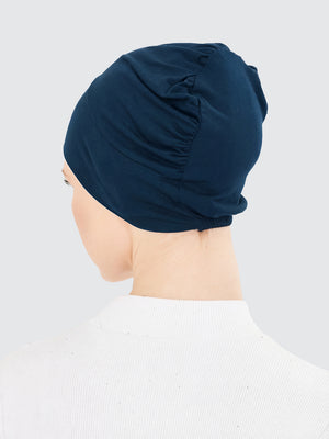 Imaarah teal hijab undercap back view showing gathered stretch construction