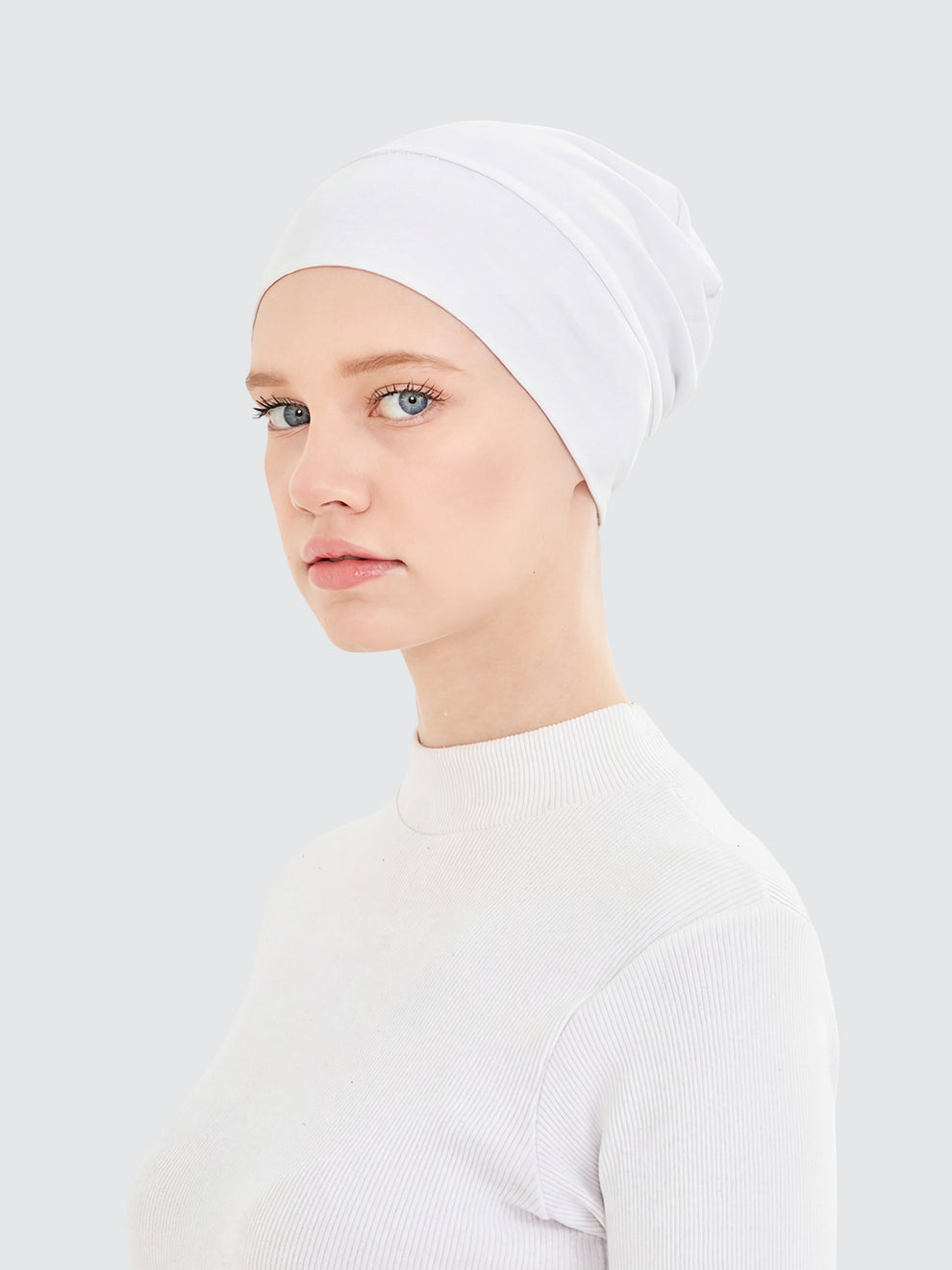 Imaarah white hijab undercap showing smooth breathable stretch fit