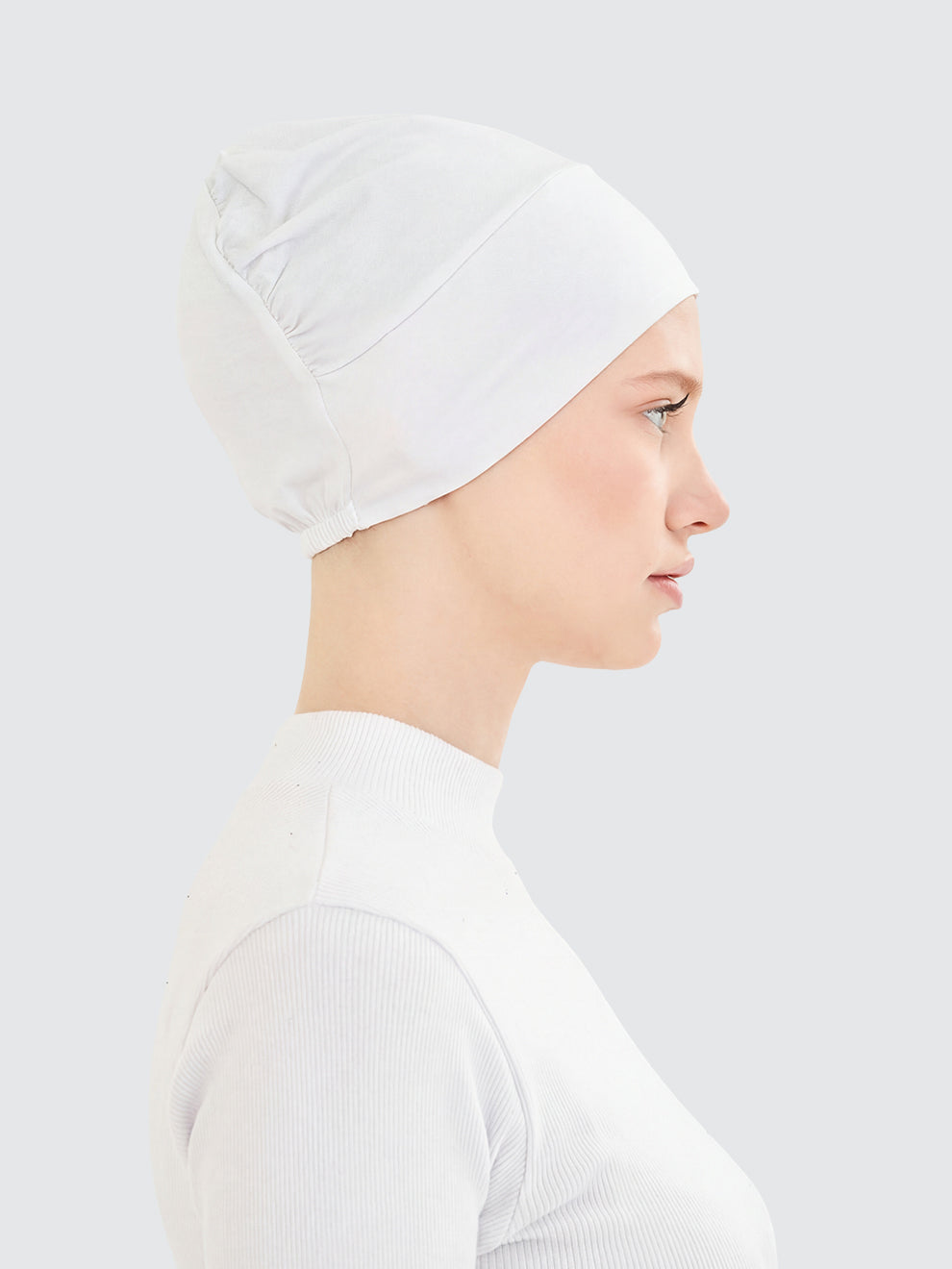 Imaarah white hijab undercap side view with clean neutral coverage