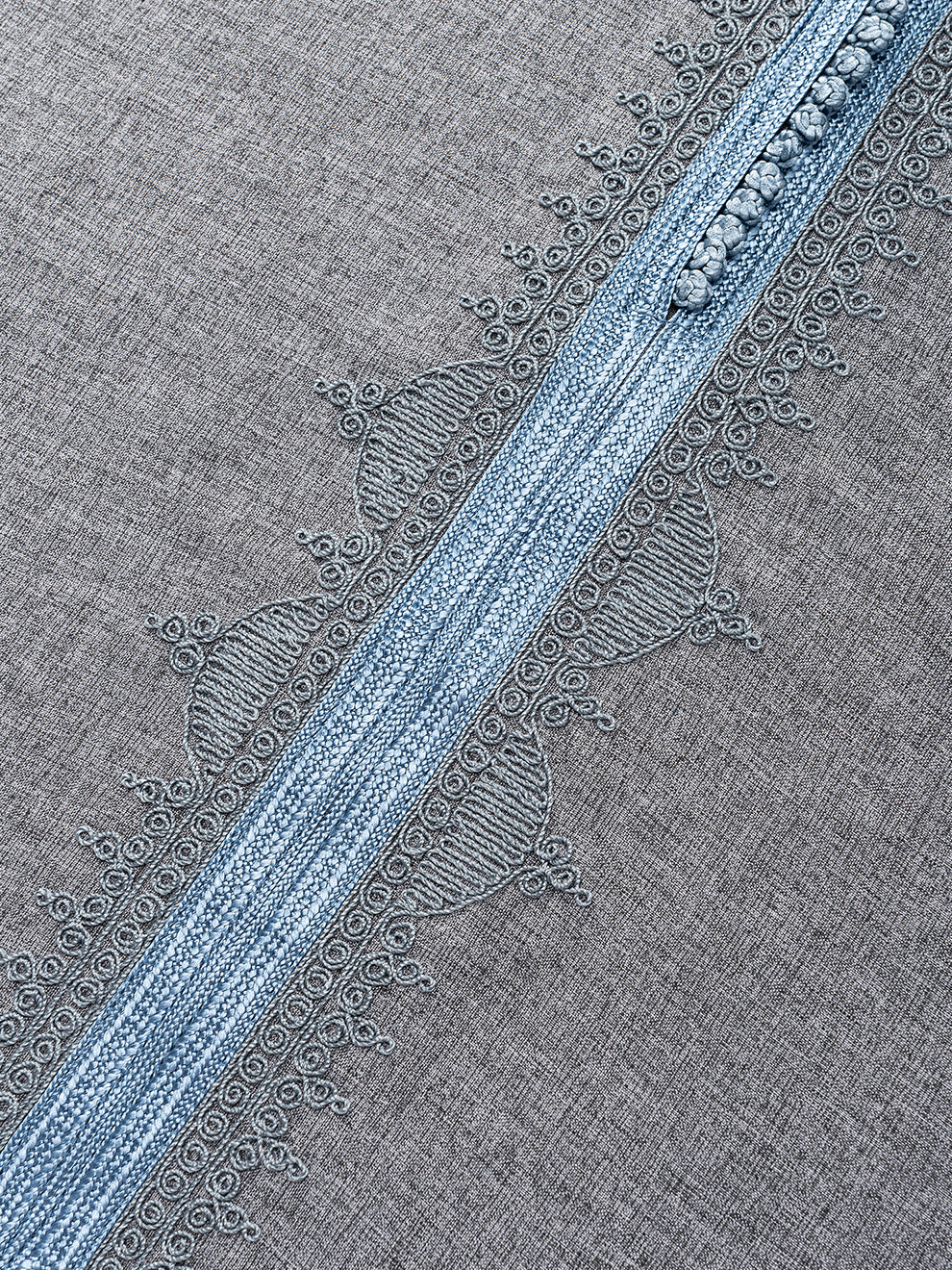 Moroccan thobe Qasr grey with sky blue woven neckline detail close up