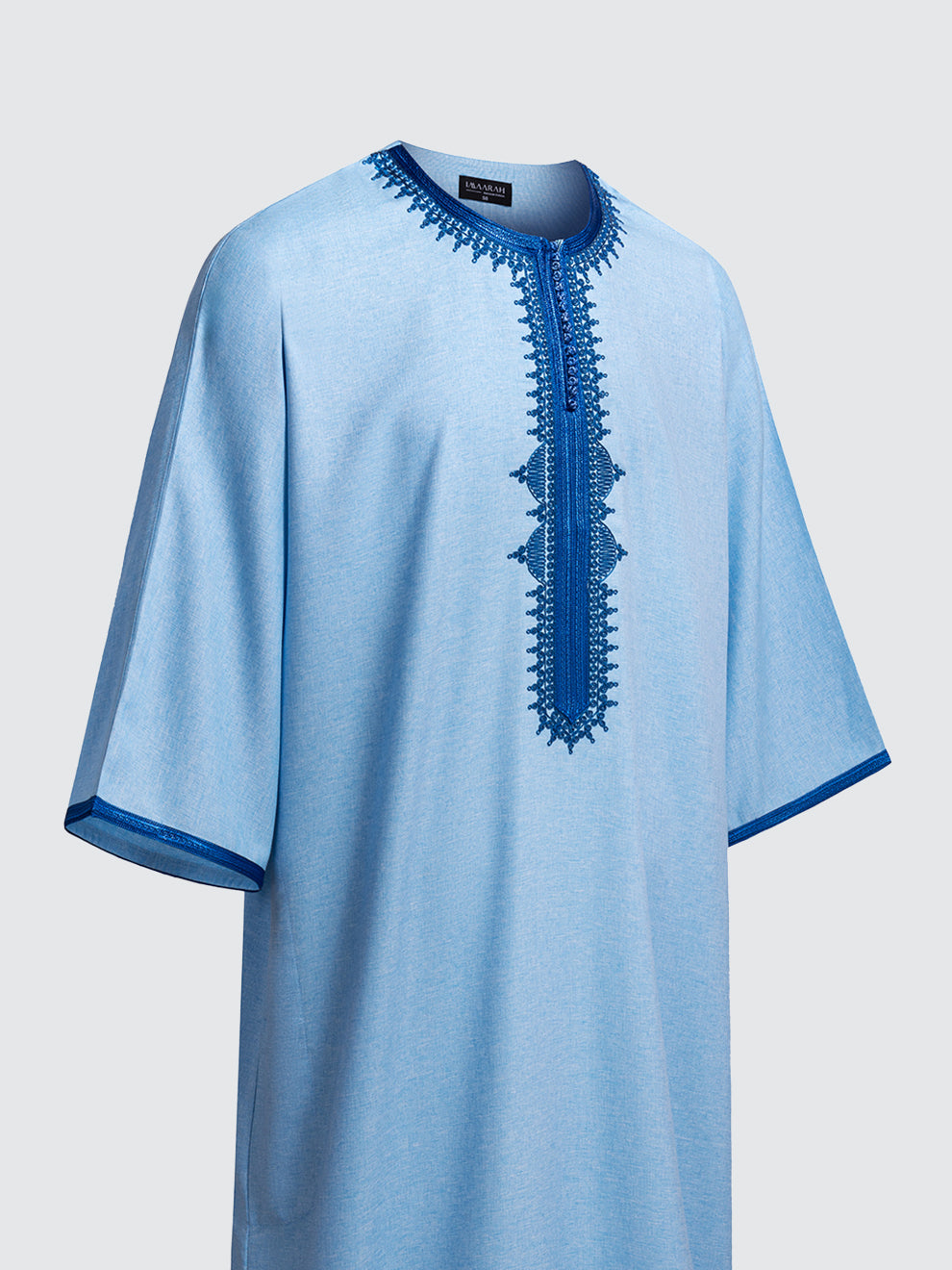 Imaarah Moroccan Short Sleeve Thobe Qasr Sky Blue with Royal Blue embroidery, angled side view