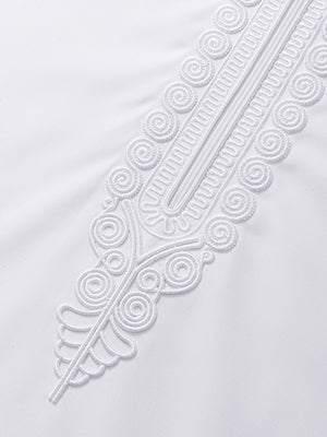 Detailed view of imperial Moroccan embroidery on white thobe placket, highlighting luxury stitching and ceremonial design elements