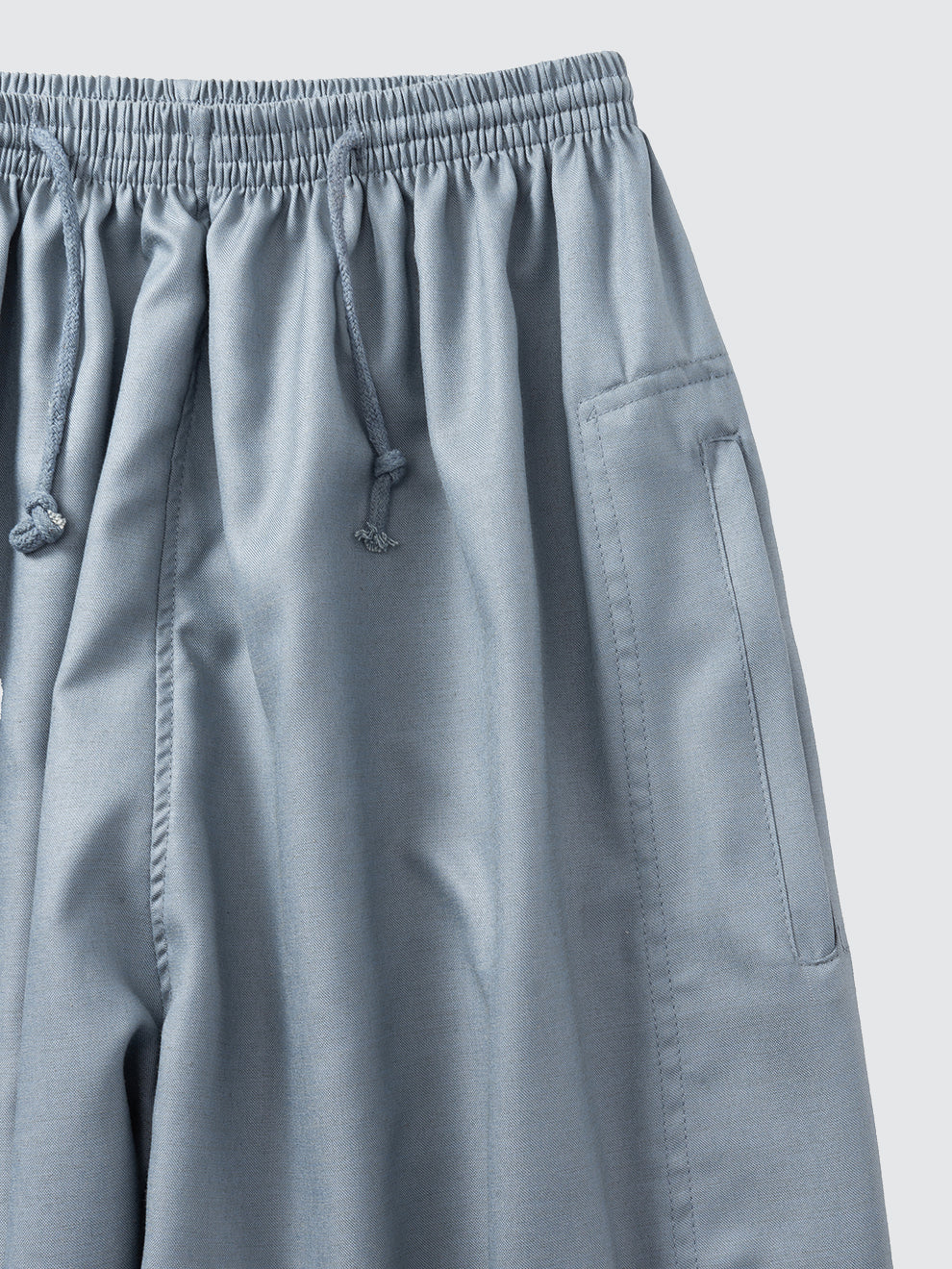 Zip side pocket detail on slate blue matching pants from Andalus Moroccan thobe set by Imaarah