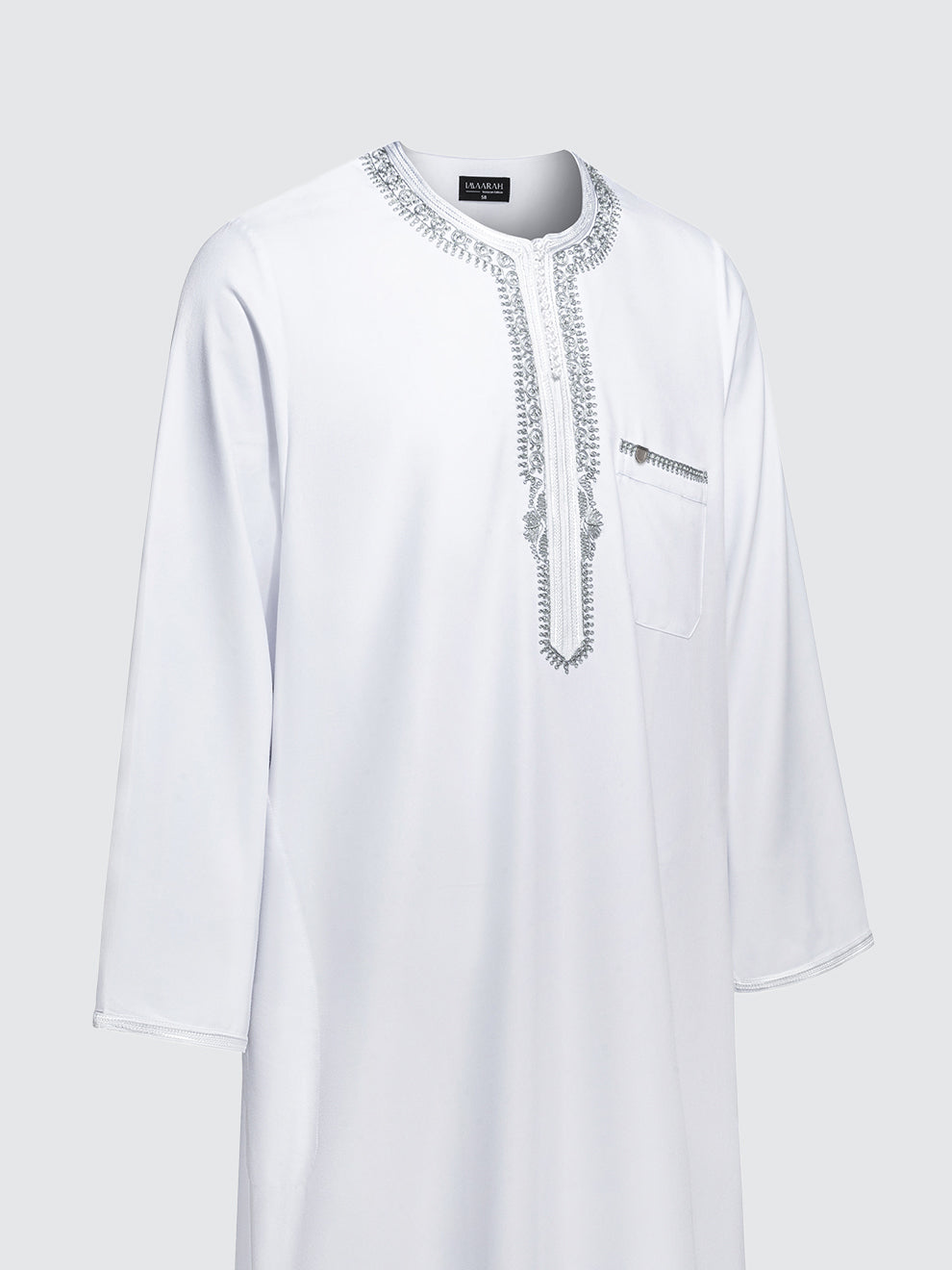 Side view of Imaarah Andalus long sleeve Moroccan thobe in white highlighting relaxed fit and grey embroidery detailing
