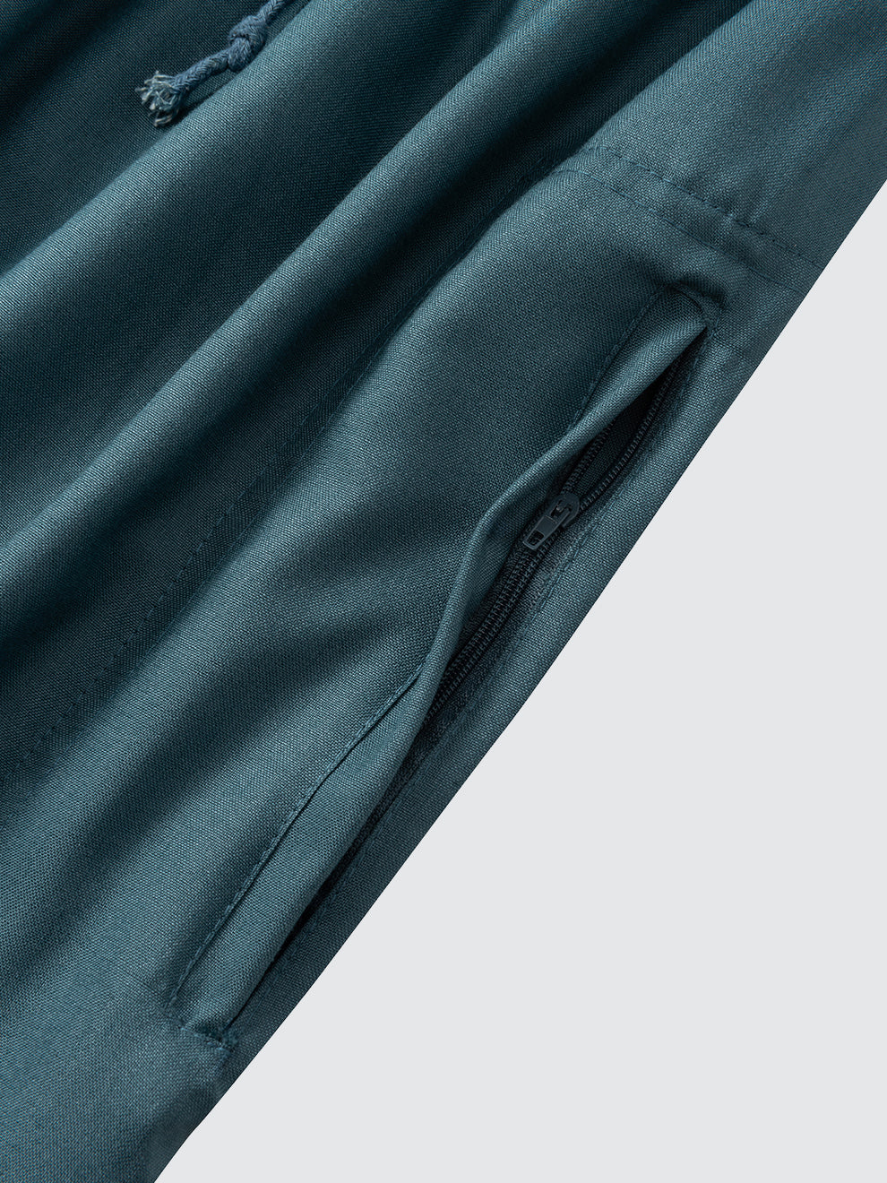Zip side pocket detail on emarald green Moroccan thobe pants